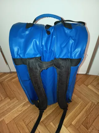 Paletero Asics azul y naranja