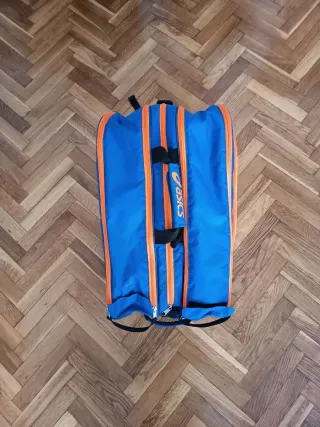 Paletero Asics azul y naranja