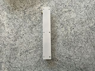 Tope de puerta metálico