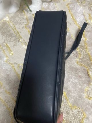 Bolso Saint Laurent azul con detalles dorados