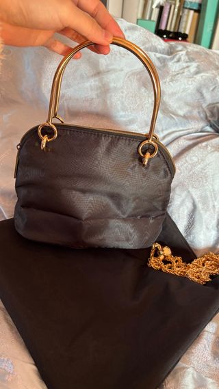 Pochette Gucci nera con catena oro