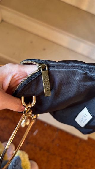 Pochette Gucci nera con catena oro