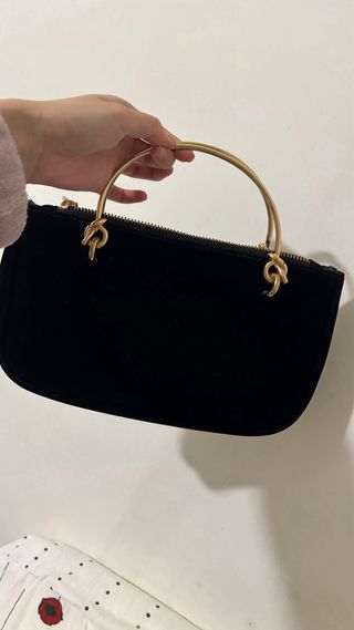 Pochette Gucci Beauty nera con ape dorata