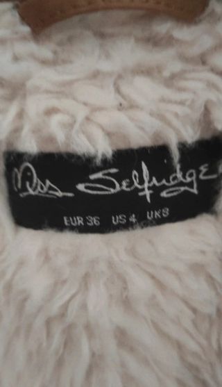 Parka con pelliccia marrone e bianca