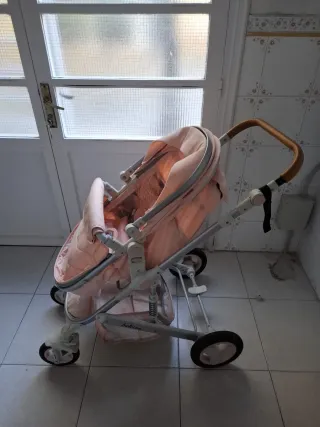 Carrito bebé rosa y blanco