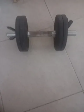 Banco de pesas con discos mas bicicleta  mancuerna