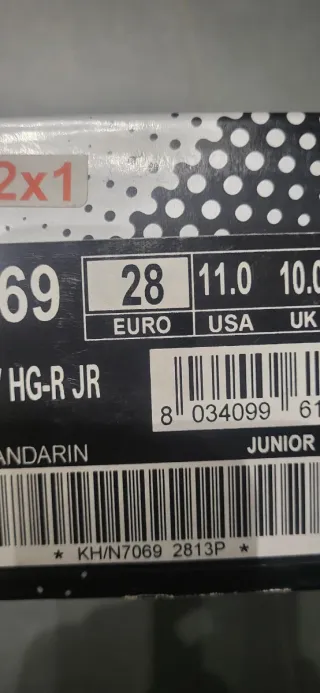 Botas de fútbol Lotto negras y naranjas