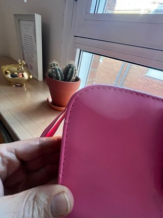 Funda rosa para cámara Instax.