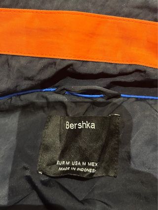 Giacca bomber blu e arancione