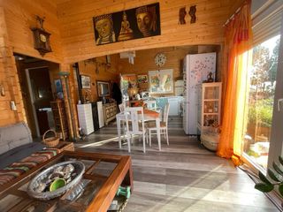 Venta de terreno urbano con casa de madera