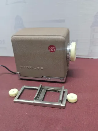 Proyector Minolta Mini + Autocharger