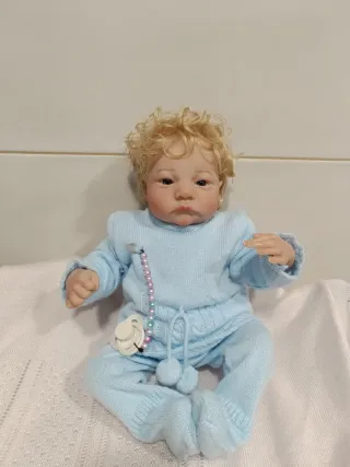 Muñeco bebé reborn rubio con chupete
