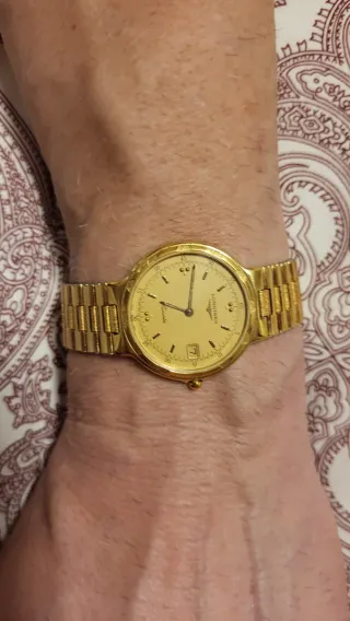 Reloj Longines Conquest chapado en oro.