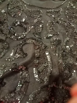 Sottogiacca nero con paillettes