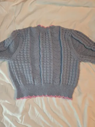 Chaqueta punto azul con detalles rosa