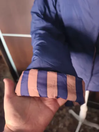 Chaqueta reversible plumas beige y azul