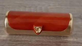 Porta pintalabios naranja y dorado