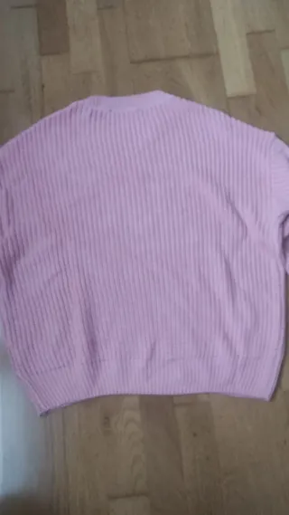 Jersey rosa de punto con manga trenzada