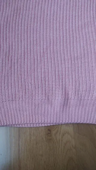 Jersey rosa de punto con manga trenzada