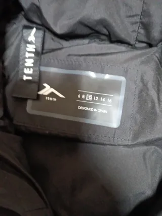 Abrigo infantil blanco y negro