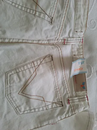 Pantalón campana blanco roto