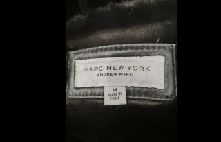 Abrigo de cuero negro con pelo