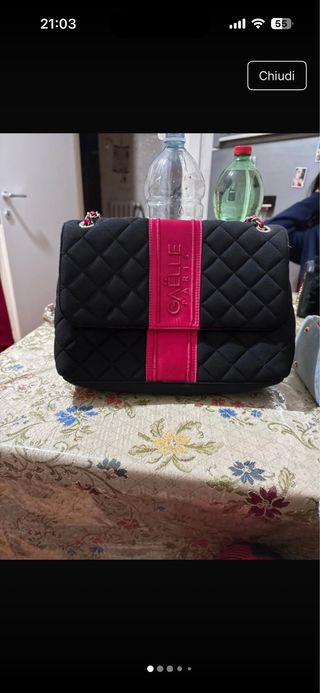 Borsa Gaëlle nera con dettagli fucsia