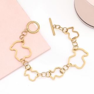 Pulsera dorada con eslabones de figuras