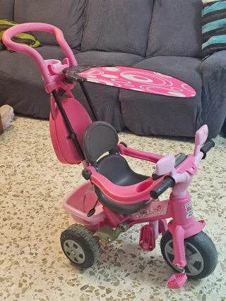 Triciclo infantil rosa con toldo