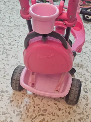Triciclo infantil rosa con toldo