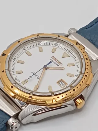 Reloj Seiko SQ 100 Oro y acero