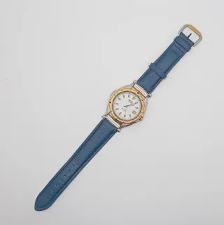 Reloj Seiko SQ 100 Oro y acero