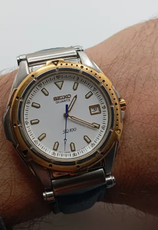 Reloj Seiko SQ 100 Oro y acero