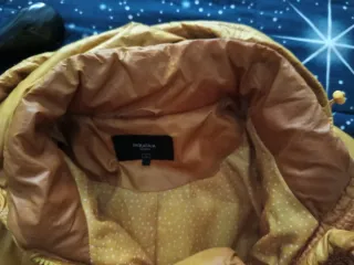 Piumino donna giallo con cappuccio