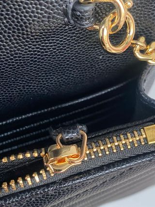 Bolso bandolera YSL negro y dorado