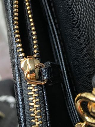 Bolso bandolera YSL negro y dorado