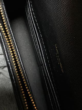Bolso bandolera YSL negro y dorado