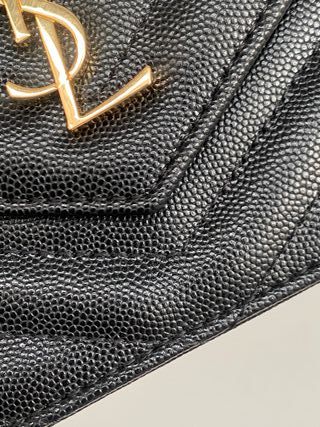 Bolso bandolera YSL negro y dorado