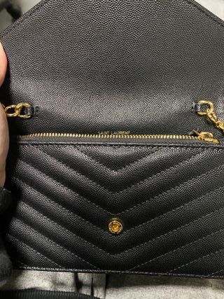 Bolso bandolera YSL negro y dorado