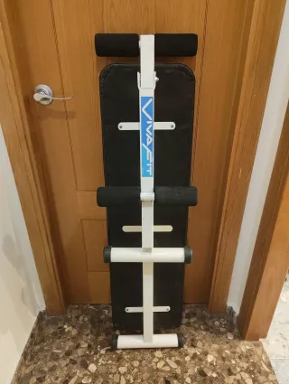 Banco de musculación y pesas