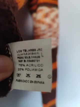 Jersey de punto cuello alto rayas. Punto fino.