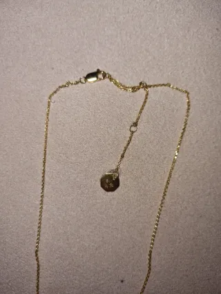 Collar Parfois dorado con piedra blanca