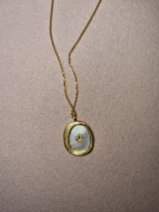 Collar Parfois dorado con piedra blanca