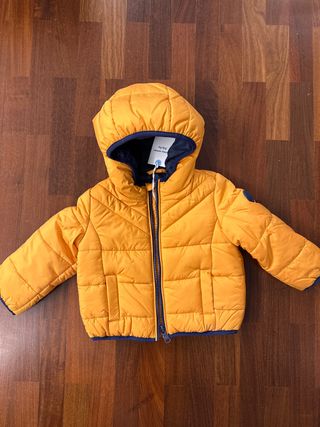 Piumino neonato arancione con cappuccio