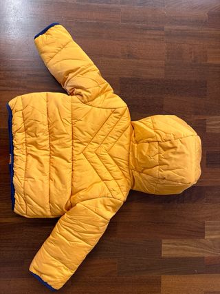 Piumino neonato arancione con cappuccio