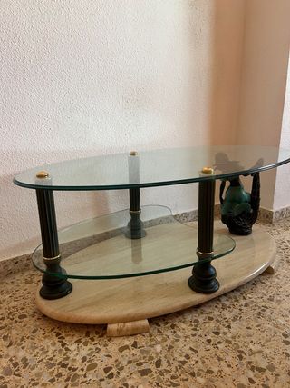 Mesita de cristal ovalada con base de piedra
