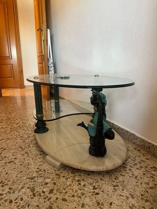 Mesita de cristal ovalada con base de piedra