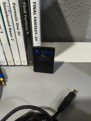 Consola PlayStation 2 + 8 Juegos y cables.