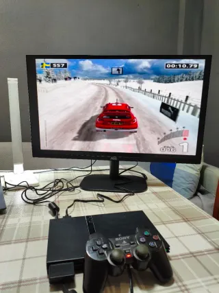 Consola PlayStation 2 + 8 Juegos y cables.