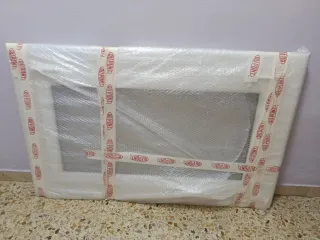 Ventana aluminio con premarco abatible